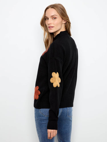 This elegant sweater showcases ribbed cuffs that add both style and functionality to your ensemble. By Charlie B.