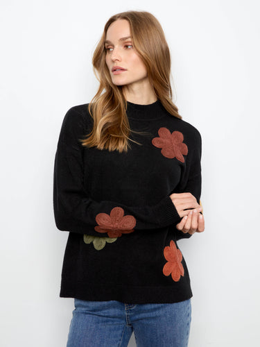 Adorned with floral appliqué embroidery, this sweater brings an artistic touch to your outfit. By Charlie B.