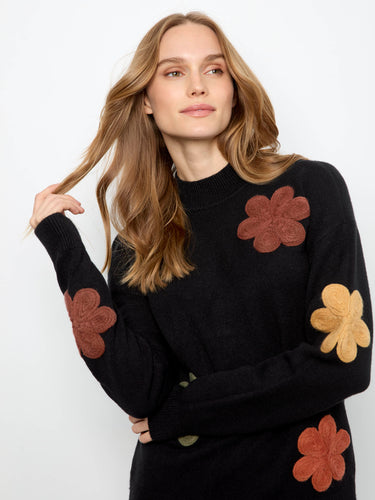 Ribbed cuffs enhance the fit and comfort of this stylish sweater, making it a cozy choice for cooler days. By Charlie B.