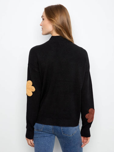 Crew neckline offers simplicity and elegance in this beautifully designed floral appliqué sweater. By Charlie B.