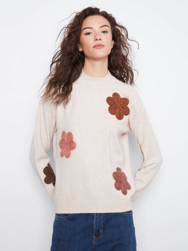 Sweater featuring a classic crew neckline with elegant floral appliqué embroidery for a touch of charm by Charlie B.