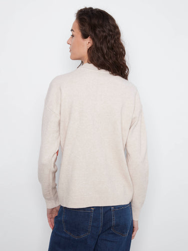 Fashionable drop shoulder design on this sweater highlights the artistic floral appliqué accents beautifully by Charlie B.
