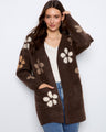 Cardigan showcasing bouclé floral details, adding a touch of elegance to any outfit. Designed for comfort and style by Charlie B.