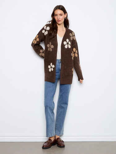 This cardigan features an open front design, perfect for layering over your favorite tops. A versatile piece by Charlie B.