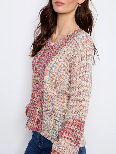 Crafted from novelty yarn, this piece offers unique texture and vibrant color combinations for standout style by Charlie B.