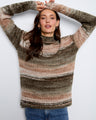 Striped sweater featuring a cozy mock neckline, perfect for chilly days. Crafted with care and style by Charlie B.