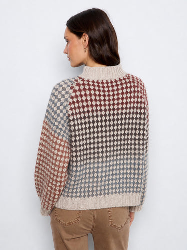 Elegant knit pattern on this cozy top enhances its unique charm and aesthetic appeal, suitable for any occasion. By Charlie B.