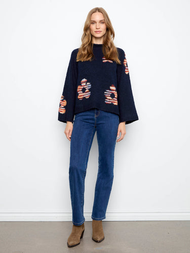 Stylish navy sweater featuring 3/4 bell sleeves and vibrant floral patterns, crafted by Charlie B.