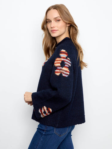 Trendy sweater in deep navy, highlighted with eye-catching flower designs and relaxed fit by Charlie B.