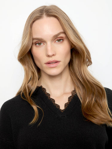 Elegant black sweater with drop shoulders, offering a relaxed and comfortable fit by Charlie B.