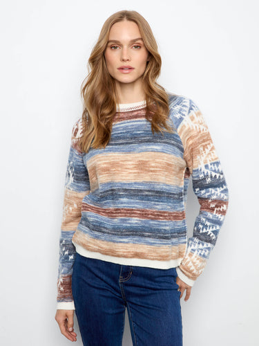 Sweater featuring a crew neckline, perfect for casual outings. The design offers comfort and style in one piece. By Charlie B.