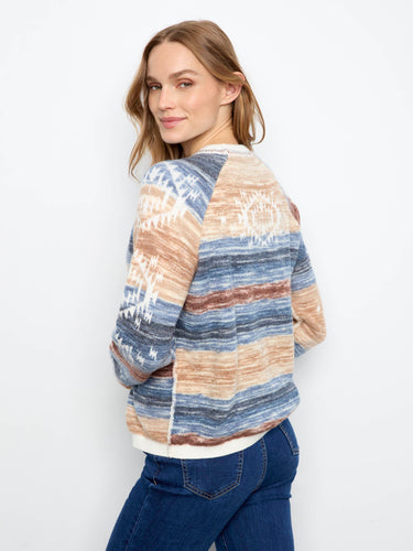Crafted with double-layer knit for added warmth and durability, this sweater is a winter essential. By Charlie B.