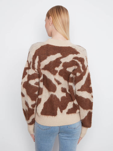 V-neckline adds sophistication to this versatile cardigan, complementing any outfit by Charlie B.