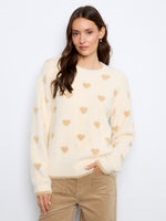 Sweater with a classic crew neckline and charming heart embroidery for a playful touch. Perfect for casual outings. By Charlie B.