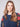 Elegant crew neckline complements the detailed floral sleeves of this denim sweater by Charlie B.