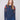Denim sweater with a crew neckline and floral embroidery, adding elegance to casual wear by Charlie B.