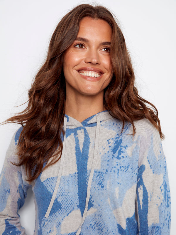 Abstract printed sweater featuring drop shoulders for a relaxed fit, ideal for everyday wear by Charlie B.