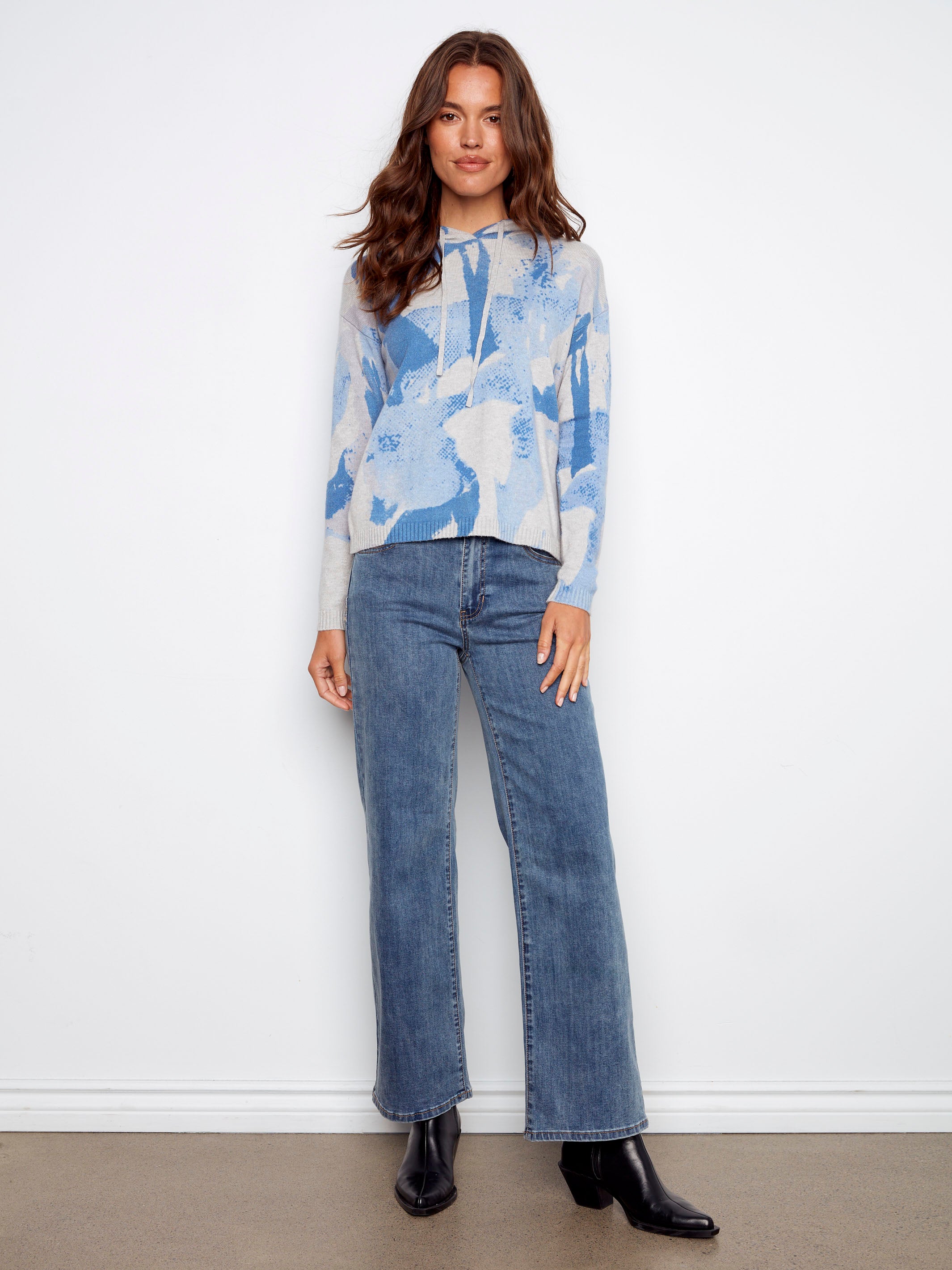 Knit cuffs on this blue abstract hoodie add a touch of comfort and style to your wardrobe by Charlie B.