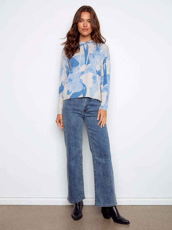 Knit cuffs on this blue abstract hoodie add a touch of comfort and style to your wardrobe by Charlie B.