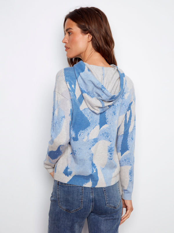 Blue abstract printed sweater with hood, showcasing drop shoulders for added comfort by Charlie B.