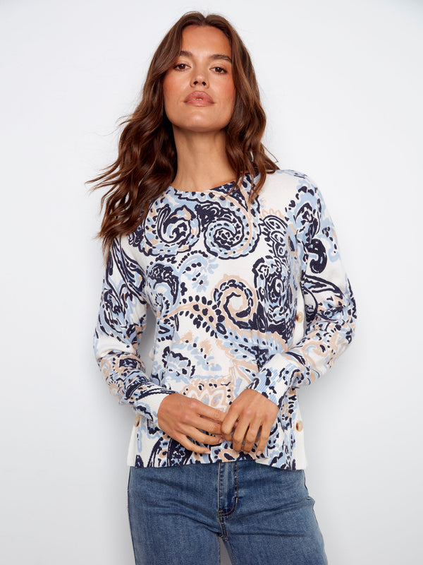 Abstract Rococo print on this crew neck sweater offers a modern twist on classic style by Charlie B.