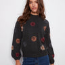 Charcoal sweater adorned with floral embroidery, featuring a stylish drop shoulder design by Charlie B.