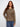 Spruce sweater featuring a distinctive ripped hem effect, adding a touch of edge to a classic style by Charlie B.