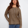 Spruce sweater featuring a distinctive ripped hem effect, adding a touch of edge to a classic style by Charlie B.
