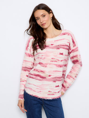 Stylish sweater showcasing a reversible design in pink and white hues for versatile wear by Charlie B.