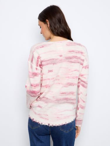 Relaxed drop shoulders provide comfort in this trendy pink and white knit sweater by Charlie B.