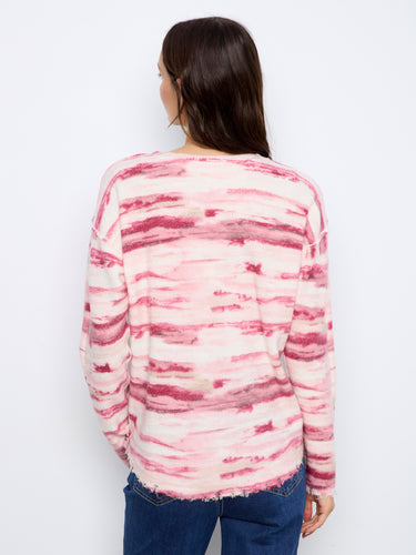 Distinctive distressed edges make this cozy pink and white striped sweater stand out by Charlie B.
