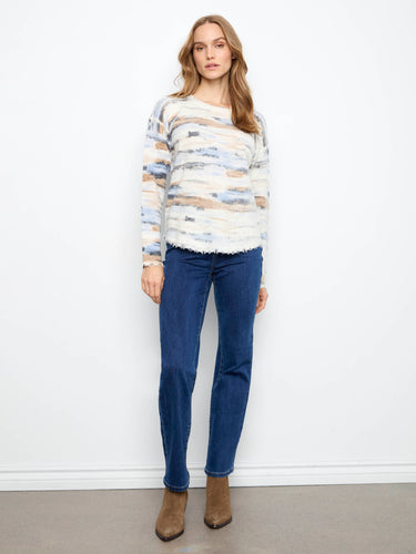 The reversible design of this sweater provides versatile styling options, making it a must-have in any wardrobe. By Charlie B.