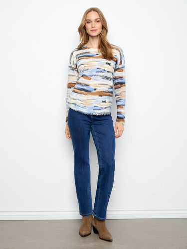 Showcasing drop shoulders, this sweater offers a relaxed fit that enhances comfort without compromising on style. By Charlie B.