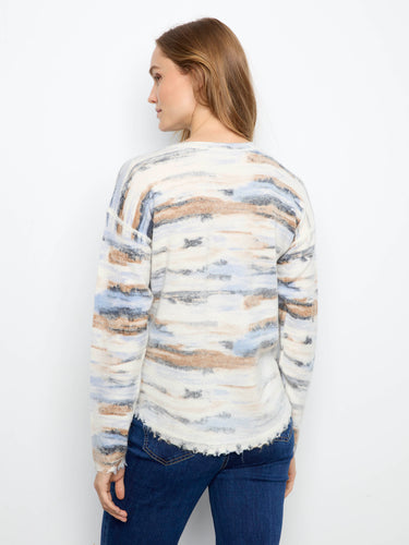 Distressed edges add an edgy flair to this stylish sweater, perfect for adding character to your casual outfits. By Charlie B.