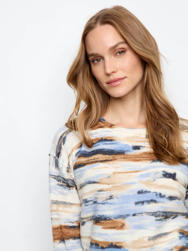 Crafted with attention to detail, the plush knit ensures warmth while maintaining a stylish appearance year-round. By Charlie B.