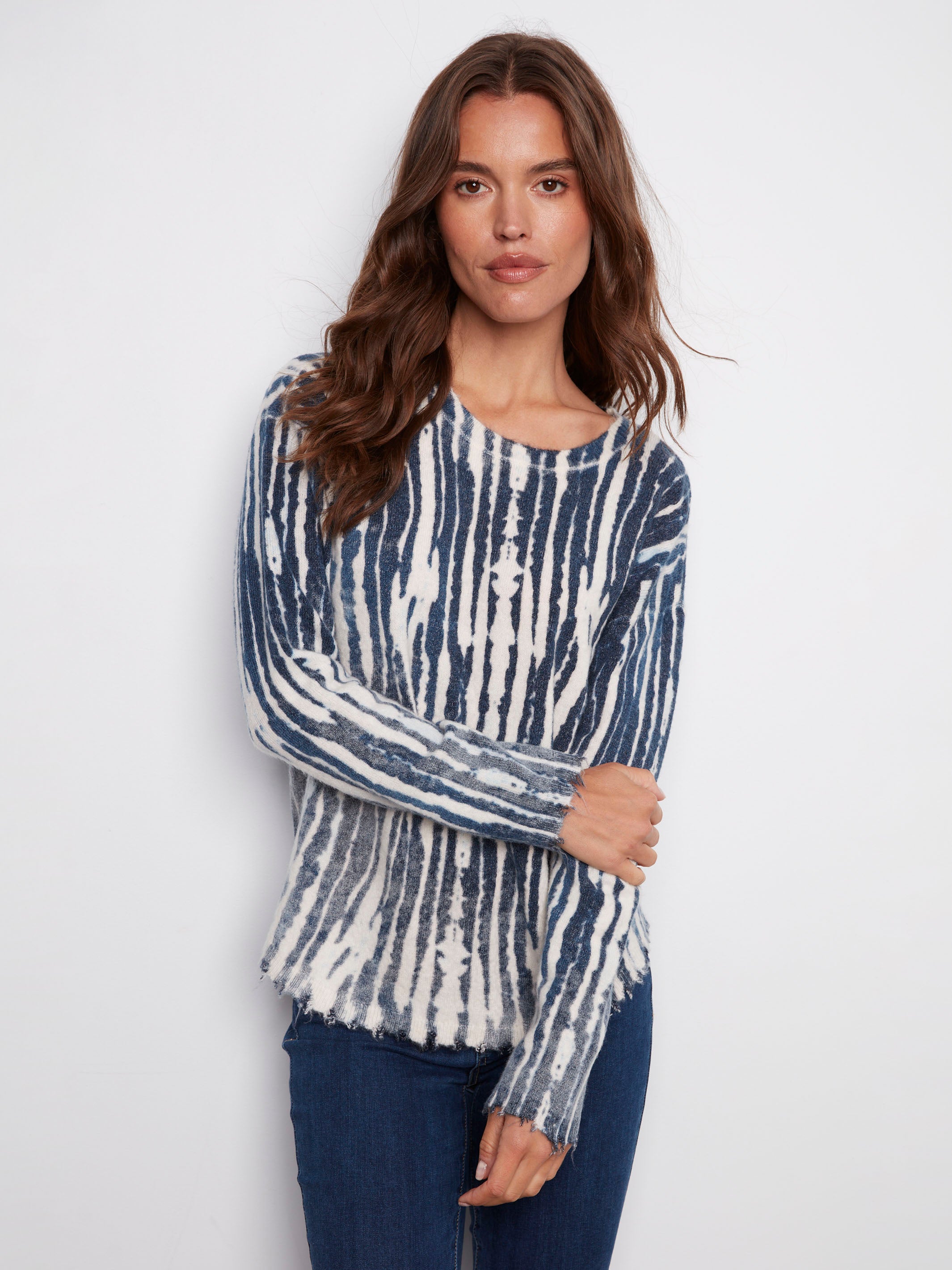 Blue and white abstract printed sweater with a cozy plush texture, perfect for chilly days by Charlie B.