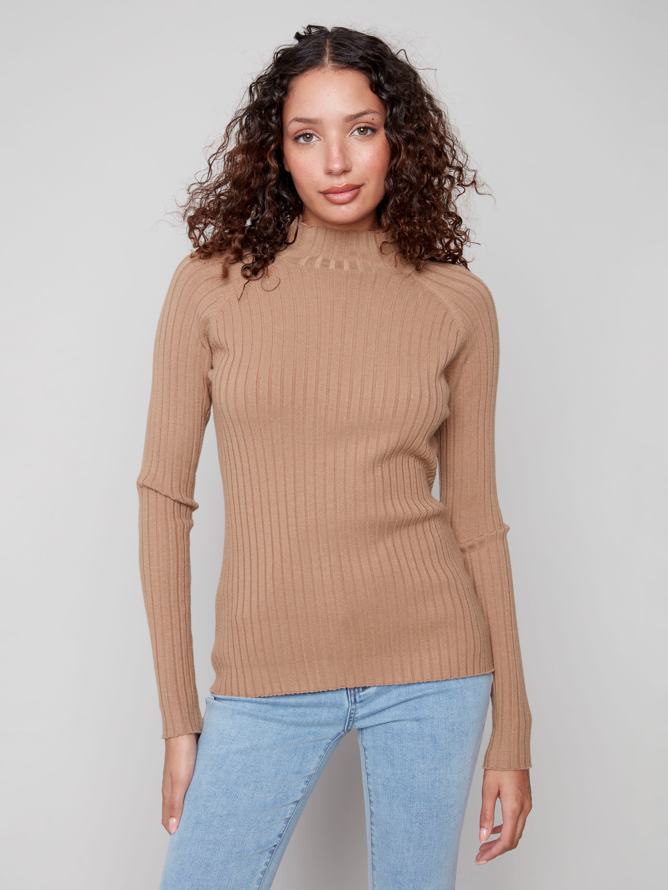 Elegant truffle sweater crafted from ribbed knit fabric, complete with long sleeves for added warmth by Charlie B.