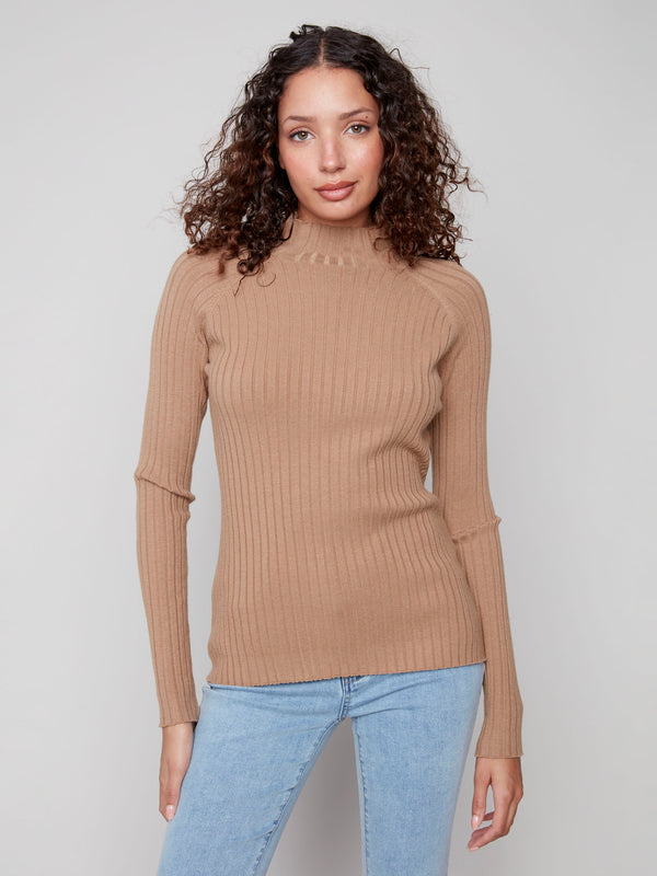 Elegant truffle sweater crafted from ribbed knit fabric, complete with long sleeves for added warmth by Charlie B.