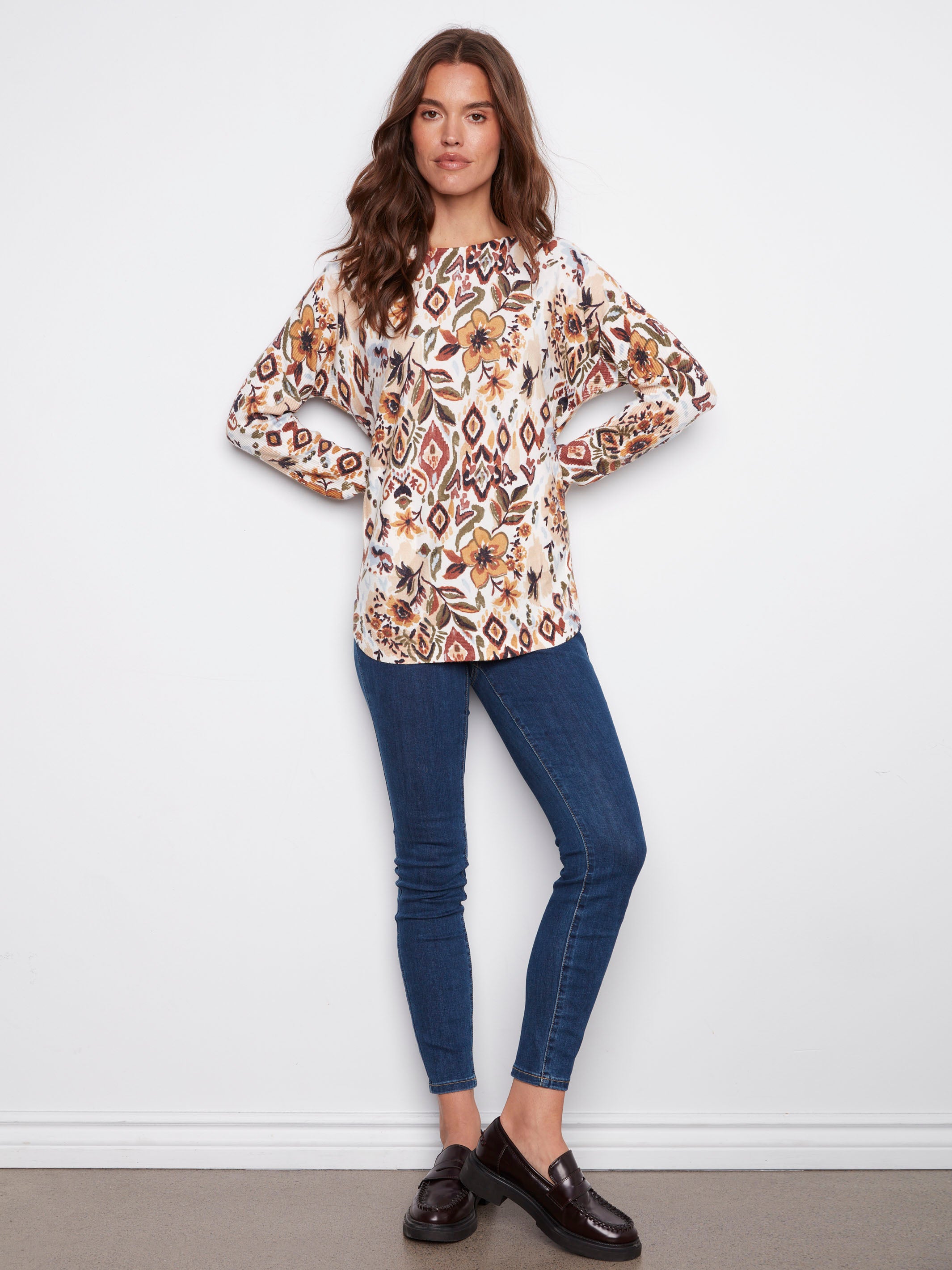 Elegant sweater with ribbed sleeves and a striking abstract floral pattern, adding a touch of sophistication by Charlie B.