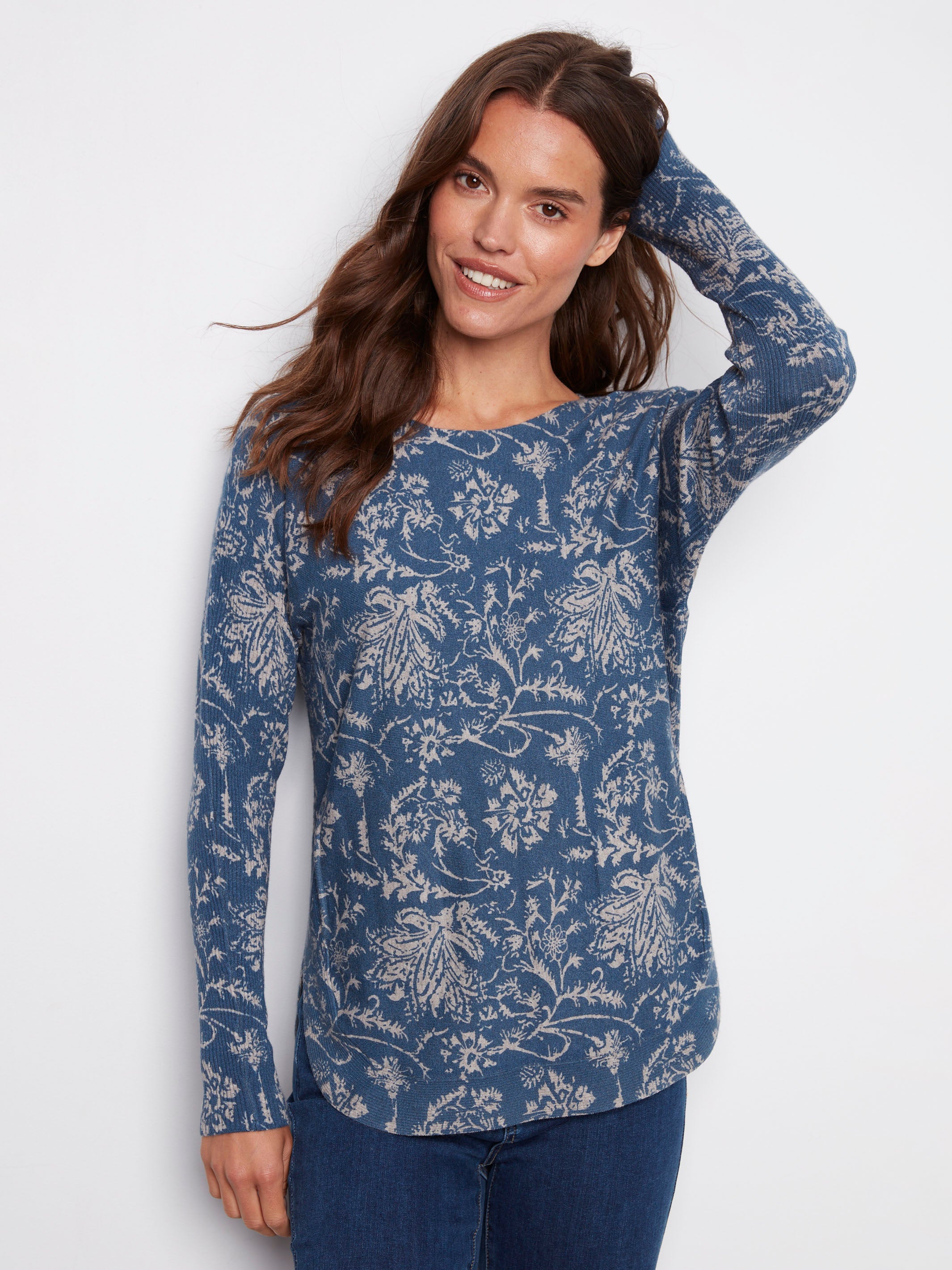 Blue sweater featuring a boat neck and abstract floral design, perfect for casual wear by Charlie B.
