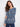 Elegant blue sweater showcasing side slits and a delicate floral print, adding charm to any outfit by Charlie B.
