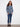 Trendy blue sweater designed with side pockets and an artistic floral motif for added convenience by Charlie B.