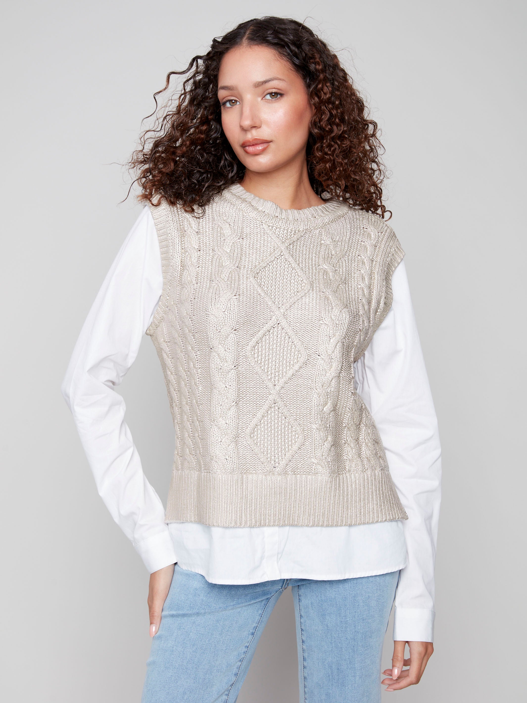 Gold foiled cable knit sweater vest with a fooler layered poplin shirt design, offering a chic and versatile look by Charlie B.