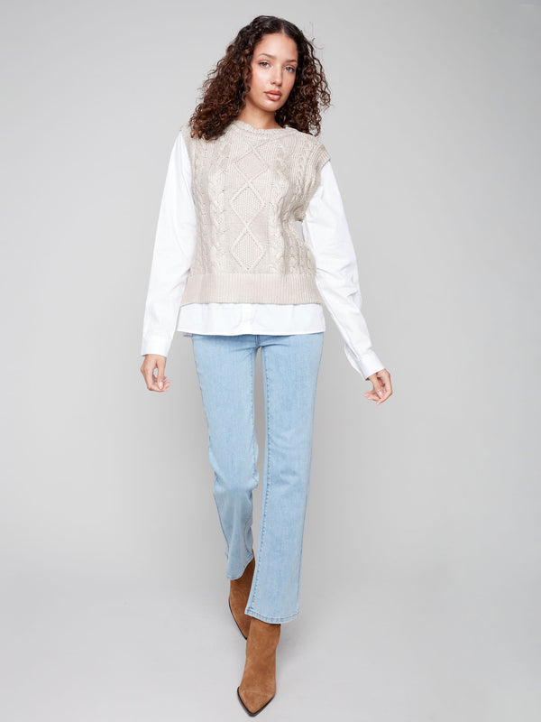 Elegant sleeveless sweater vest in gold foil with crew neck, showcasing the intricate cable knit pattern for a stylish touch by Charlie B.