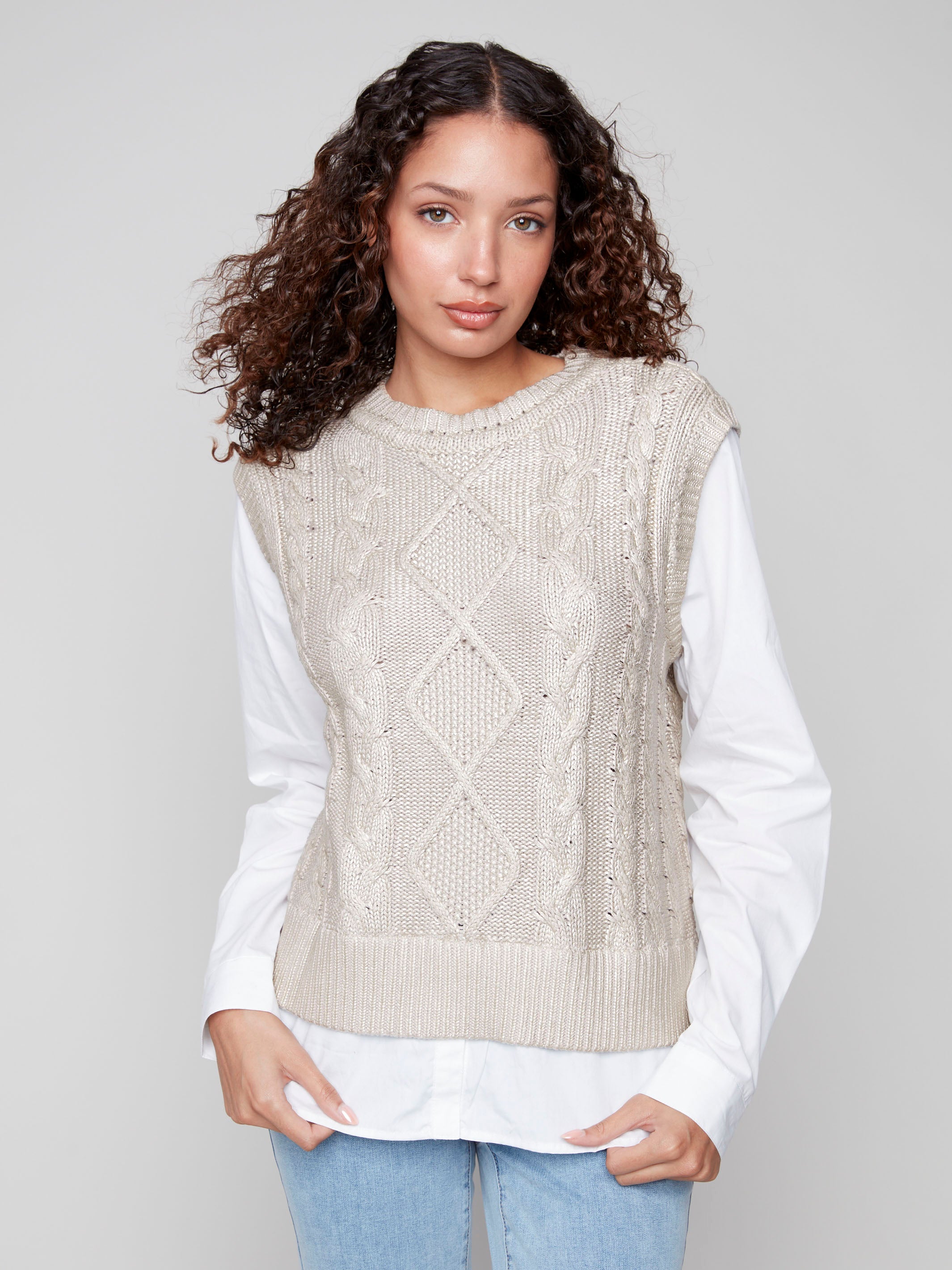Stylish vest featuring a gold foiled cable knit design and fooler layered shirt style, perfect for any casual outing by Charlie B.