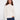 Ecru jacquard sweater featuring a mock neck and ribbed hem, highlighted by raglan sleeves for a relaxed fit by Charlie B.