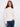 Ecru jacquard sweater featuring a mock neck and ribbed hem, highlighted by raglan sleeves for a relaxed fit by Charlie B.