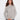 Heather light grey sweater with mock neck and ribbed hem, featuring raglan sleeves for a relaxed fit by Charlie B.