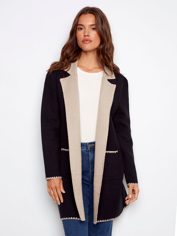 Black cardigan featuring contrast interior and patch pockets, ideal for layering by Charlie B.