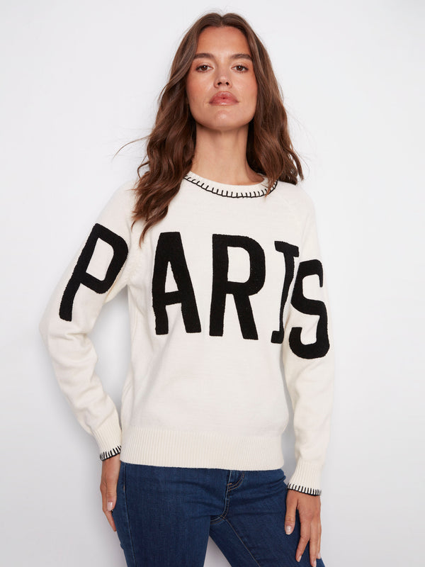 Elegant white sweater adorned with detailed blanket stitch accents and 'PARIS' embroidery by Charlie B.